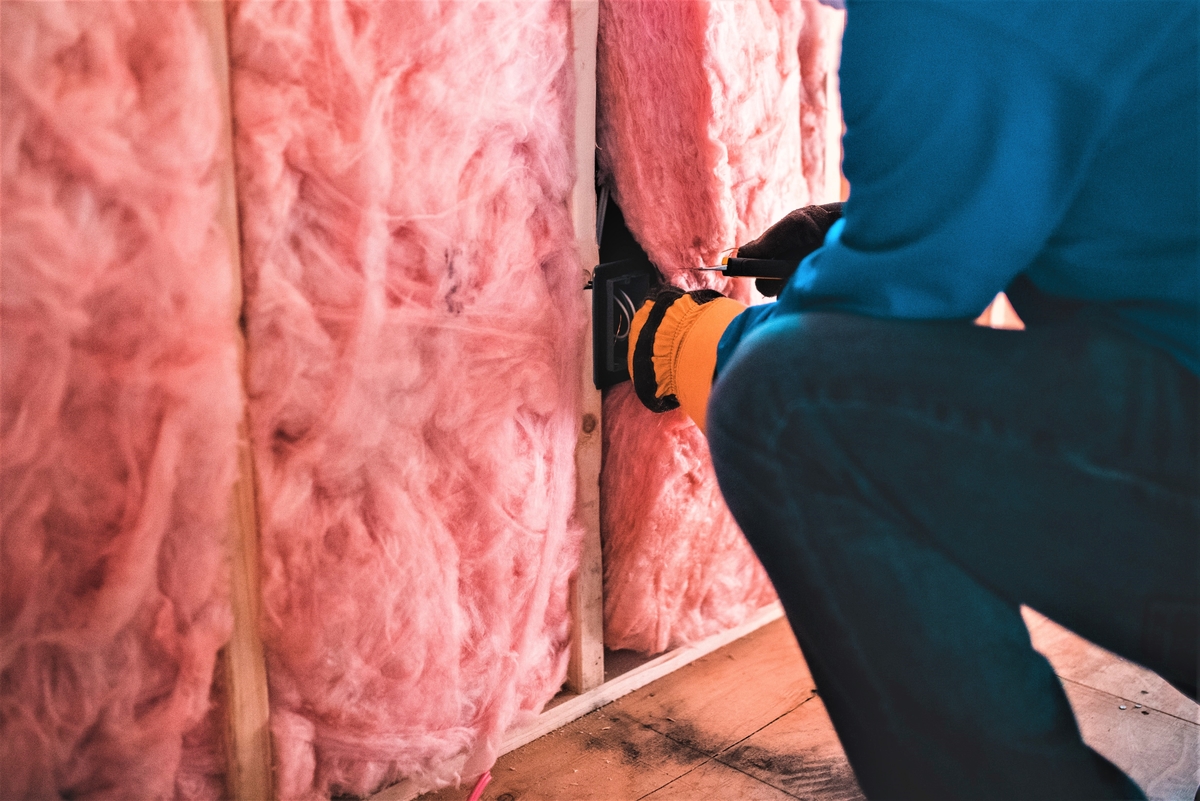 fiberglass insulation installed within wall